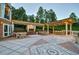 Spacious patio with fireplace, seating, and bar area at 5326 Presley Pl, Douglasville, GA 30135