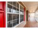 Front porch detail showcasing windows and red shutters at 1117 Campbell Rd, Lawrenceville, GA 30045
