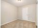 Bright entryway with neutral colored walls and carpeted floor at 3122 Orbit Cir, Ellenwood, GA 30294