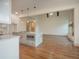 Open kitchen with island, white cabinets, and stainless steel appliances at 987 Kora Sw Dr, Marietta, GA 30064