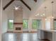 Spacious great room boasts hardwood floors, stone fireplace, and high ceilings at 987 Kora Sw Dr, Marietta, GA 30064