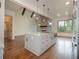 Open kitchen with island, stainless steel appliances, and hardwood floors at 987 Kora Sw Dr, Marietta, GA 30064