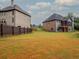 Large backyard with two houses visible at 987 Kora Sw Dr, Marietta, GA 30064
