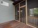Screened porch with wood decking and view of backyard at 987 Kora Sw Dr, Marietta, GA 30064
