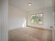 Bright bedroom with neutral carpeting and a large window at 987 Kora Sw Dr, Marietta, GA 30064
