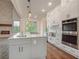 Modern kitchen with stainless steel appliances and white cabinets at 987 Kora Sw Dr, Marietta, GA 30064