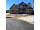Two-story brick home with a large front yard and driveway at 987 Kora Sw Dr, Marietta, GA 30064