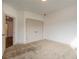 Bedroom with double doors leading to a closet and carpet flooring at 987 Kora Sw Dr, Marietta, GA 30064