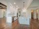 Modern kitchen with white cabinets, large island, and stainless steel appliances at 987 Kora Sw Dr, Marietta, GA 30064