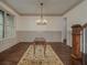 Formal dining room with hardwood floors and chandelier at 987 Kora Sw Dr, Marietta, GA 30064