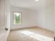 Bright bedroom featuring neutral carpeting and large window at 987 Kora Sw Dr, Marietta, GA 30064
