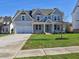 Two-story house with gray siding, white trim, and a two-car garage at 330 Cavin Dr, Roswell, GA 30076