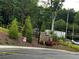 Landscaped entrance with stone pillars and signage at 2335 Portrush Way (Lot 26) Dr, Atlanta, GA 30339