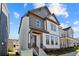 Two-story home with gray and white siding, a front porch, and landscaping at 1952 Stanfield Nw Ave, Atlanta, GA 30318