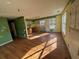 Large kitchen with wood flooring needing renovation at 915 Campbell Rd, Covington, GA 30014