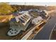 Aerial view of a new community with various housing styles and a town square at 428 10Th St, Auburn, GA 30011