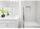 Clean bathroom with a single vanity and shower/tub combo at 428 10Th St, Auburn, GA 30011