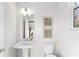 Clean and bright bathroom with pedestal sink and window at 428 10Th St, Auburn, GA 30011