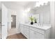 Bathroom with double vanity and a view into another room at 428 10Th St, Auburn, GA 30011