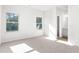 Bright bedroom with carpet, dual windows, and en-suite bathroom at 428 10Th St, Auburn, GA 30011