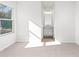 Well-lit bedroom with carpet, window, and en-suite access at 428 10Th St, Auburn, GA 30011