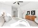 Bright bedroom with a king-size bed, and a wooden cabinet at 428 10Th St, Auburn, GA 30011