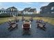 Brick fire pit surrounded by chairs in a grassy area at 428 10Th St, Auburn, GA 30011