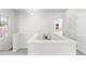 Upstairs hallway with access to bedrooms and window at 428 10Th St, Auburn, GA 30011
