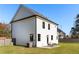 White two-story house with backyard patio and lawn at 428 10Th St, Auburn, GA 30011