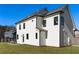 Two-story white house with black window trim and a grassy yard at 428 10Th St, Auburn, GA 30011