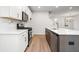 Modern kitchen with white cabinets, quartz countertops, and stainless steel appliances at 428 10Th St, Auburn, GA 30011