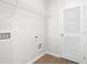 Convenient laundry room with built-in shelving and a door at 428 10Th St, Auburn, GA 30011