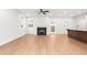 Spacious living room with hardwood floors, fireplace, and access to backyard at 428 10Th St, Auburn, GA 30011
