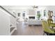 Open concept living room and kitchen with hardwood floors and fireplace at 428 10Th St, Auburn, GA 30011