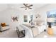 Relaxing main bedroom with large bed, seating area, and ceiling fan at 428 10Th St, Auburn, GA 30011