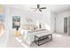 Bright main bedroom with king bed, seating area, and ceiling fan at 428 10Th St, Auburn, GA 30011