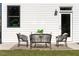 Relaxing patio with modern furniture and a grassy backyard at 428 10Th St, Auburn, GA 30011