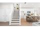 Modern staircase with dark wood treads and white risers at 428 10Th St, Auburn, GA 30011