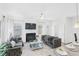 Bright and airy living room with fireplace and large windows at 11719 Chatham Dr, Hampton, GA 30228