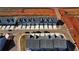 Aerial view of new townhouses with gray roofs and attached garages at 11682 Chatham Dr, Hampton, GA 30228