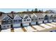 Row of new townhouses with attached garages at 11682 Chatham Dr, Hampton, GA 30228