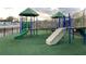 Inclusive playground featuring ramps, slides, and soft turf at 11682 Chatham Dr, Hampton, GA 30228