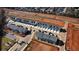 Aerial view of townhouses with gray roofs and neutral siding at 11682 Chatham Dr, Hampton, GA 30228