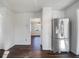 Kitchen with stainless steel refrigerator and view into dining area at 225 Woodfield Ct, Mcdonough, GA 30253