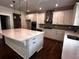 Modern kitchen with white cabinets, large island, and stainless steel appliances at 4708 Cooling Water Circle, Powder Springs, GA 30127