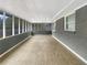 Bright and spacious screened porch with wood-look flooring at 1819 Rosewood Rd, Decatur, GA 30032