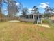 House exterior and large backyard with screened porch at 1819 Rosewood Rd, Decatur, GA 30032