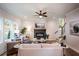 Living room with hardwood floors, a fireplace, and a ceiling fan at 3683 Bradford Way, Atlanta, GA 30331