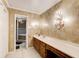 Elegant bathroom with double vanity, chandelier, and large soaking tub at 2929 Glad Dale Se Dr, Conyers, GA 30094