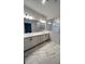 Double vanity bathroom with marble-look floors and modern lighting at 2559 Oakbourne Ln, Smyrna, GA 30080